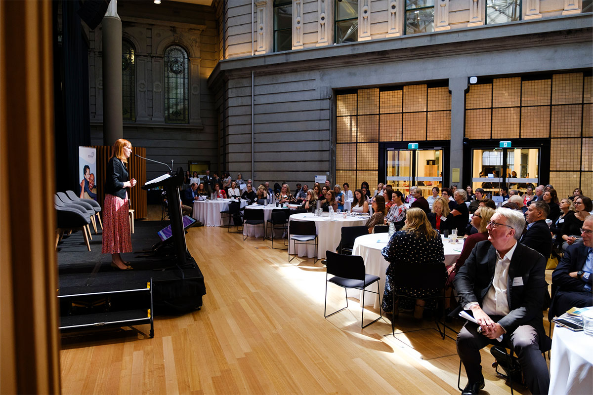 A group of people listening to a speaker at the Members Policy Forum